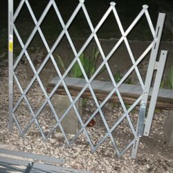 Two Uline H6938 3 x 4 3. 43 inches folding Security Gate For