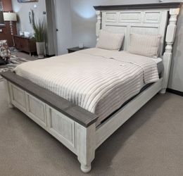 Queen bed frame, box spring and mattress.