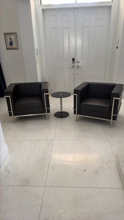 2 leather chairs and table set