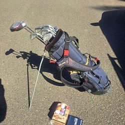 Golf Bag, 2 Drivers, Irons And Putter With 48 Balls.