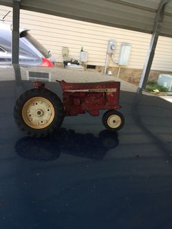 Old metal tractor for parts or leave as is