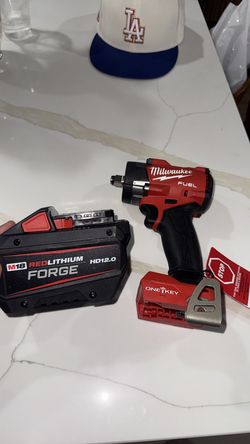 1/2” Milwaukee M18. Fuel Controlled Torque Compact Impact Wrench with 12-0 FORGE battery ..