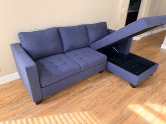 Blue upholdered two piece sectional with storage