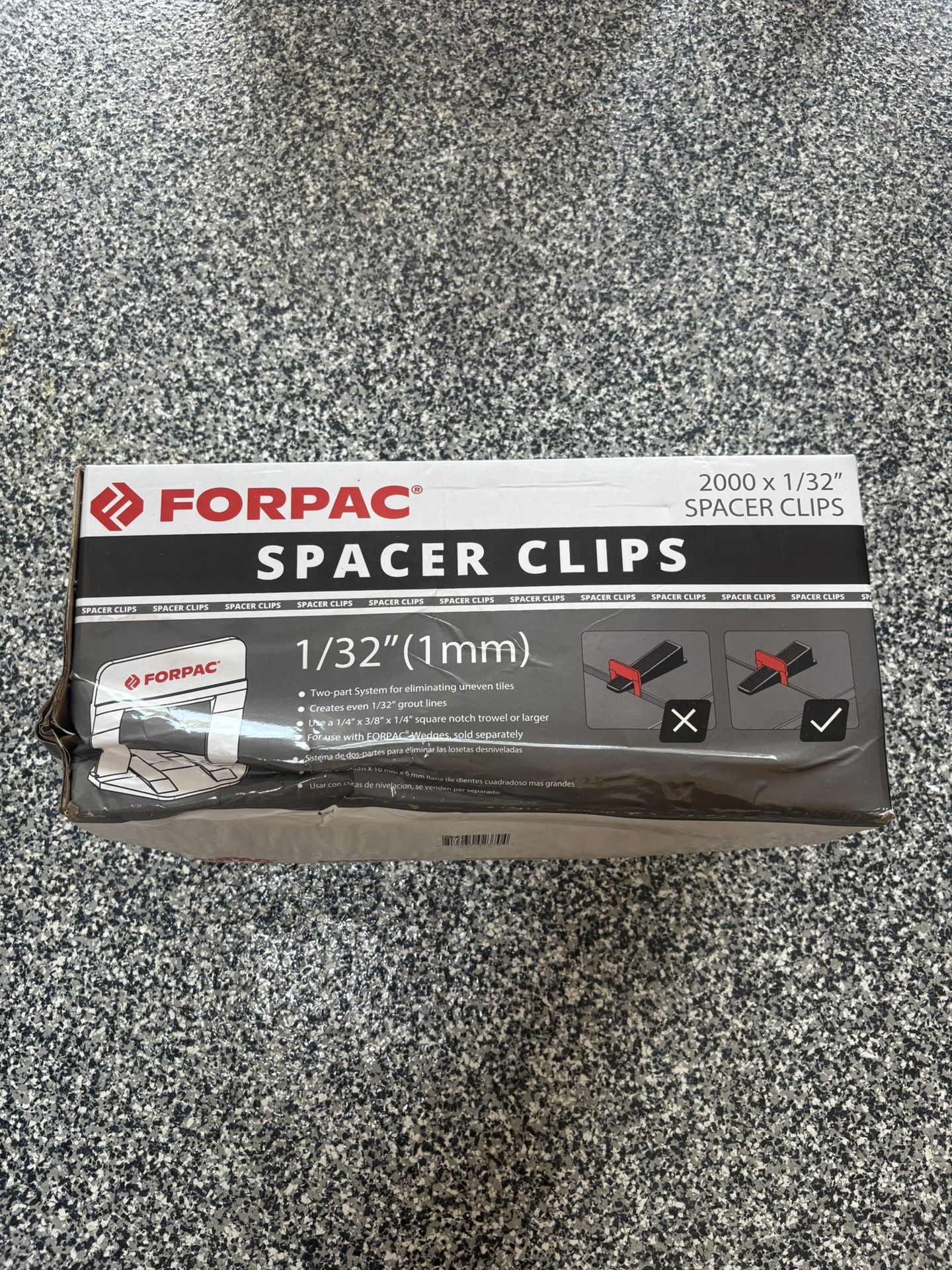 Brand new box of tile spacer clips. 2000 x 1/32” spacer clips.