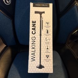 Open box. Never Used Honeybull Walking Cane