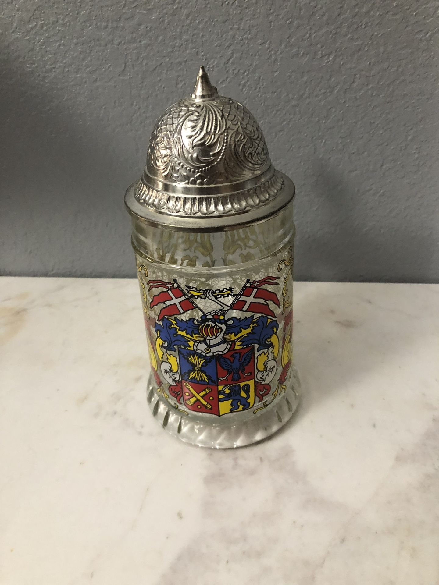 Etched Glass Beer Stein Coat of Arms.  Size 14 ounces.  Germany with a Pewter lid.  Preowned excellent condition. Has been on display in a cabinet.  S