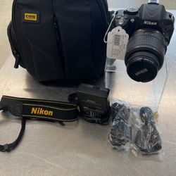 Nikon Camera Digital Model D5100 With Case, Charger And 2 Batteries 