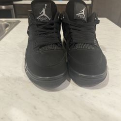 Black Cat Jordan 4’s