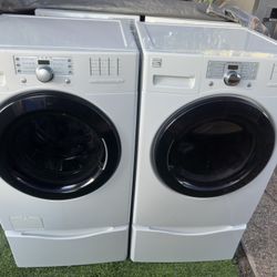 Kenmore Vibration Guard Front load washer and electric dryer on pedestals