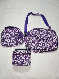 quilted purple and white damask-patterned travel bag set.