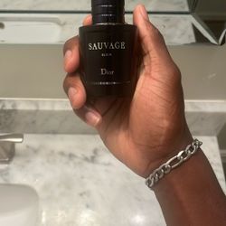 Dior Sauvauge Elixir . Cap Is Mest Up, Magnetic Top  Is Week.40 Percent In Bottle