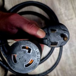 This is a NEMA 14-50P to NEMA 14-30R adapter cord