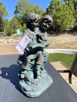 Statue Boy And Girl Reading From Alpine New