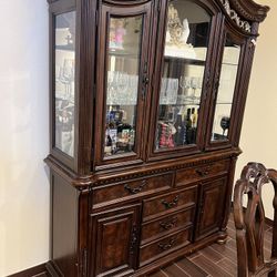 Formal Dinning Table (8 Chairs) with Hutch in really good Condition. Nothing wrong With It. Very Strong And Heavy