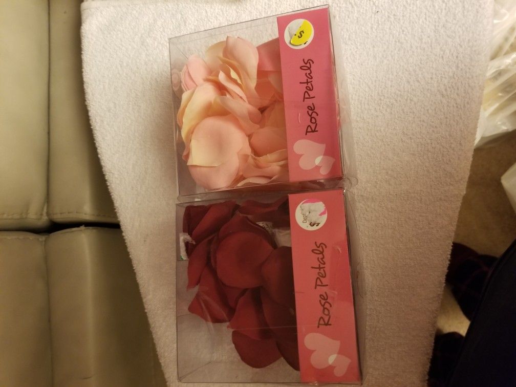 Two small boxes of rose petals