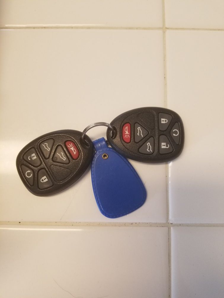 2007-2014 Chevrolet Tahoe key fobs. 1 new, 1 used.