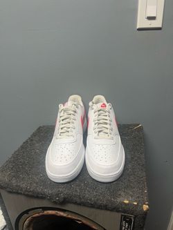 orange and white air force 1’s