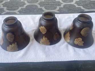 Westinghouse set of three bell shaped glass lampshades