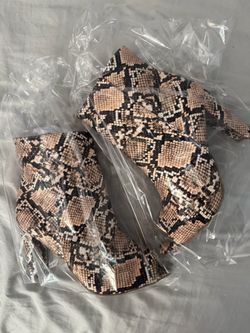 Peep toe snakeskin booties
