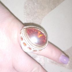 Large White Colored Statement Ring With A Large Red Stone