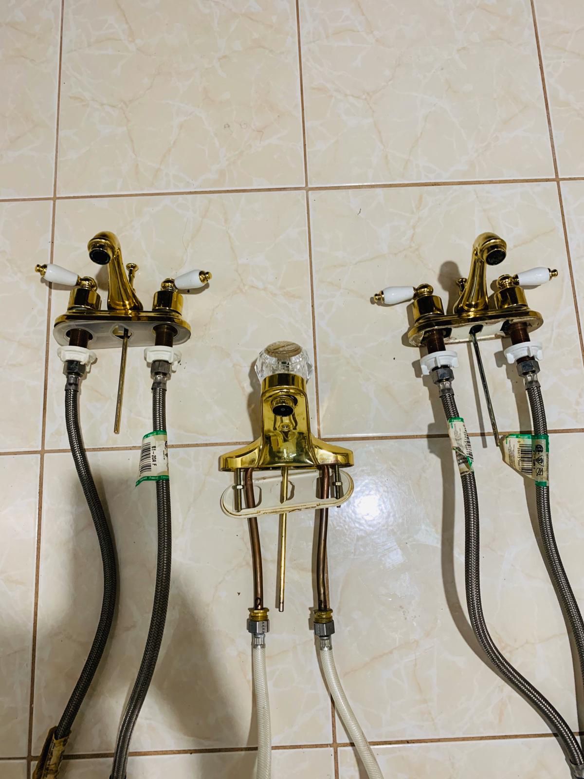THREE Gold bathroom faucets