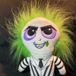 Beetlejuice plush excellent iconic character signature black and white striped suit, black boots, and wild green hair. The doll has a detai