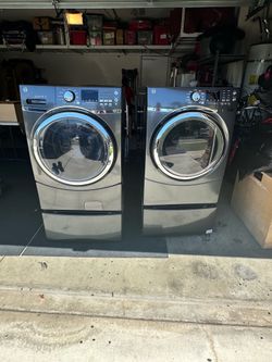 Ge washer and dryer with pedestals  color dark blue steel