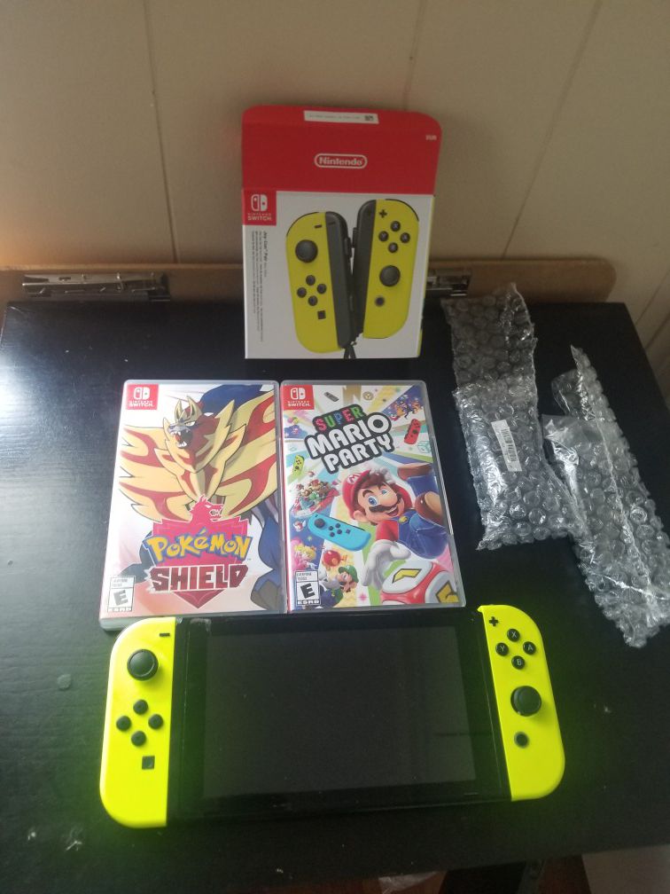 Nintendo Switch with 2 games and 4 controllers