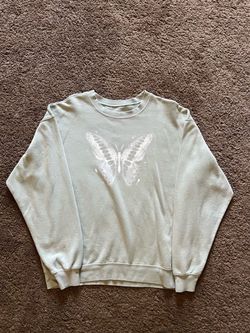 Gray butterfly crewneck sweatshirt with white butterfly graphic