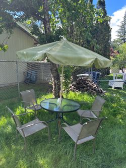 Outdoor table chairs umbrella
