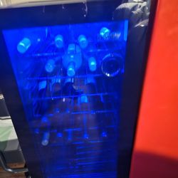 Wine Cooler & Sm. Refrigerator. Comes With 18 Bottles Of Wine