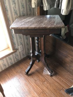 Antique table,brown marble top...