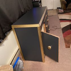  $180- (firm on price)1 Black and gold Vintage dresser! Lots of storage space behind each side door. H-2‘10“ X L 4 ft 4 1/2” X D 1‘7“  Could use a rep