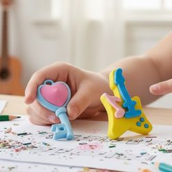 (Lot Of 2) 3D Puzzle 1" Miniature Multi-Color Erasers Figural Guitar/ Key Themed. The image displays two distinct 3D puzzle erasers. Heart Key Eraser: