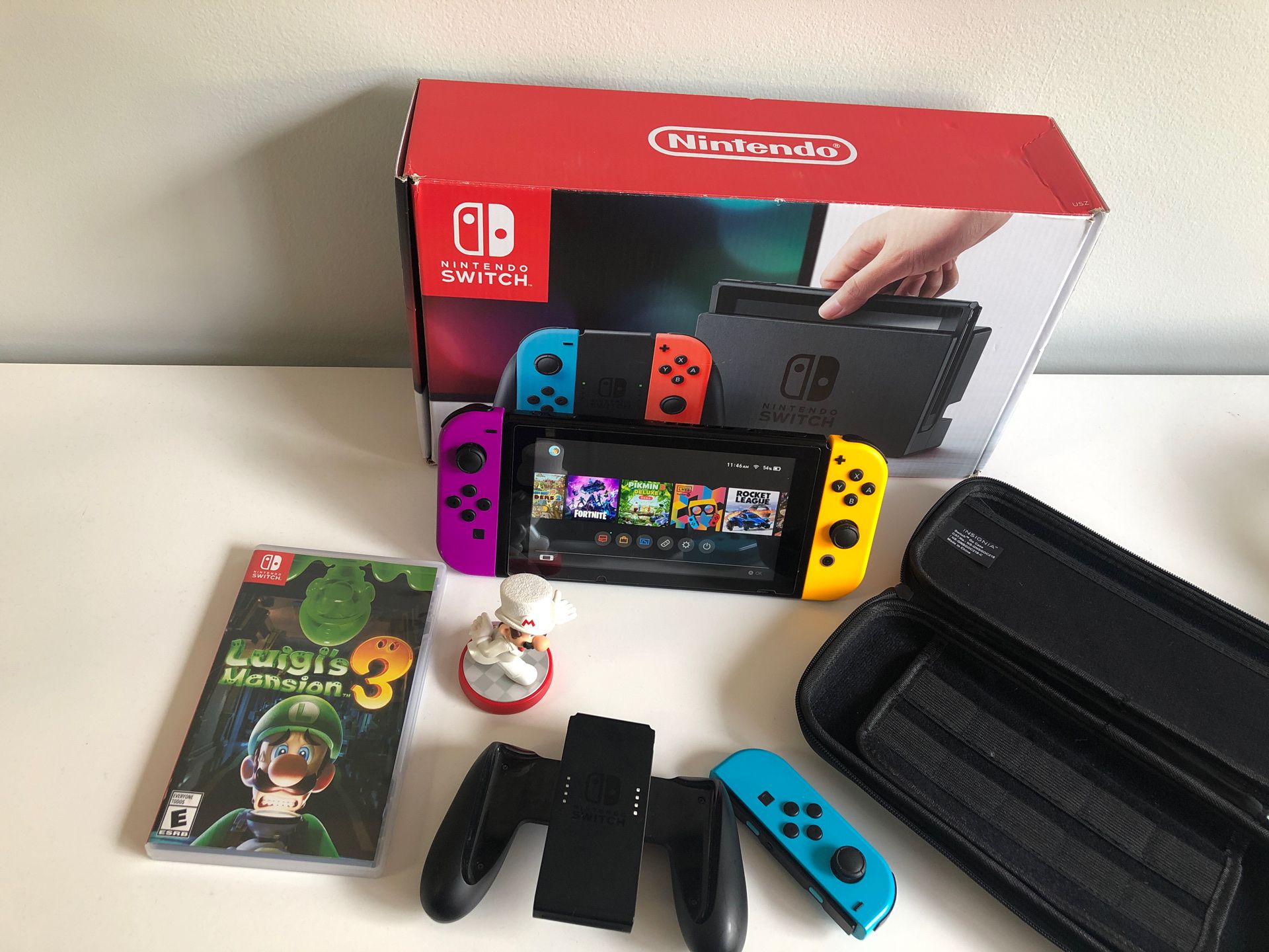 Nintendo Switch with 3 joy cons, a case , and Luigi’s Mansion 3 in mint condition