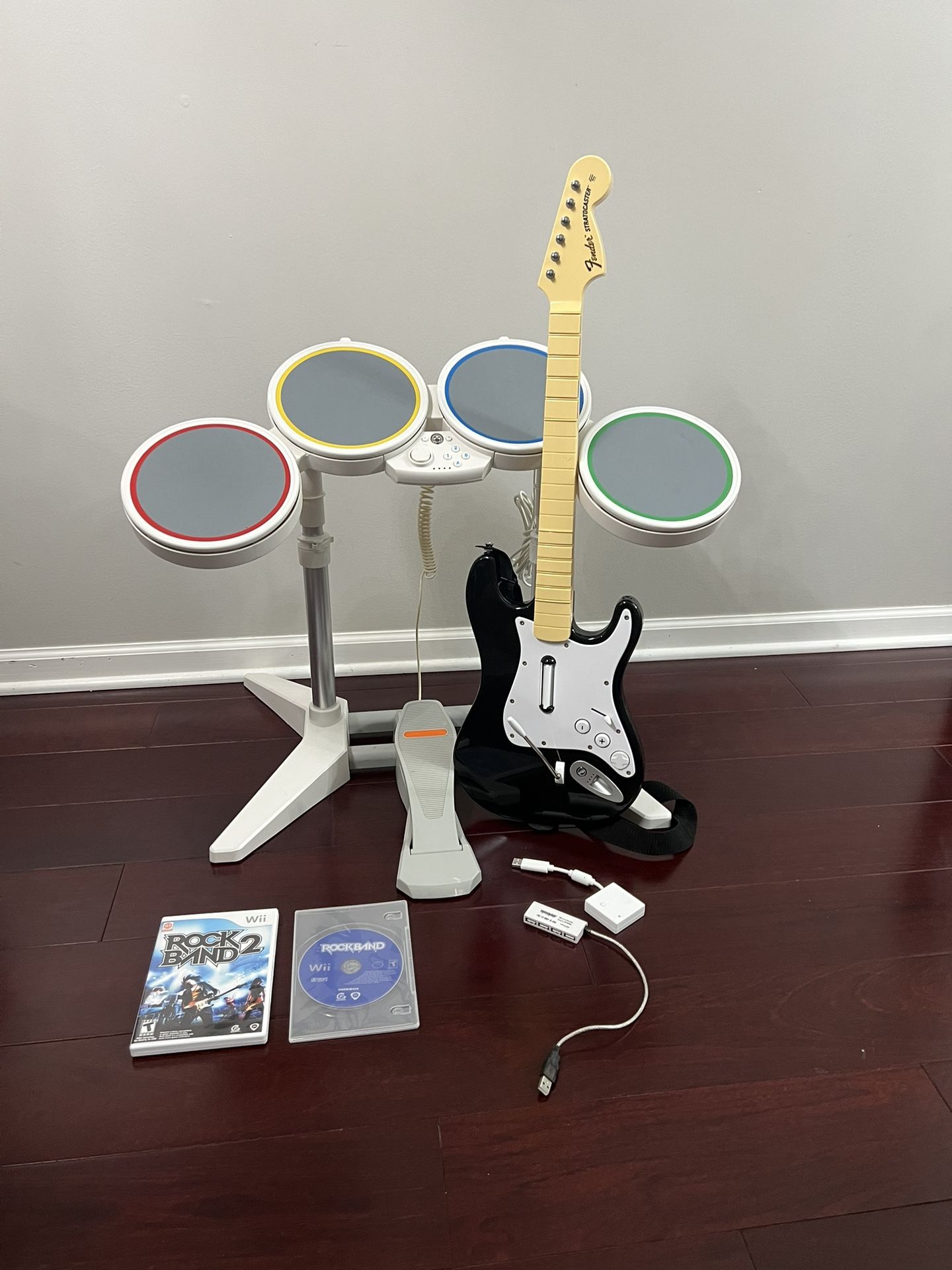 Nintendo Wii Rock band 1 and 2 ( wired drums, guitar, dongel, sticks, pedal and 2 games) TESTED