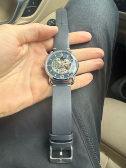 Stührling blue skeleton face watch