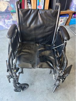 Foldable black Wheel Chair with leg rests