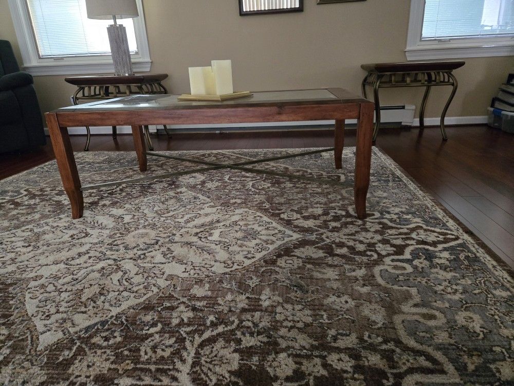 Leather wrapped coffee table , all wood with metal accents. 2 glass top wood with metal accents. Excellent condition. Will sell separately. l