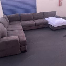 Gray Living Spaces 4 piece sectional couch. Missing 1 Cushion Cover