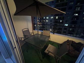 Outdoor table, 4 chairs and a shade