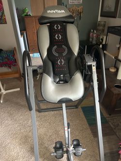 Inversion table with massage and heat