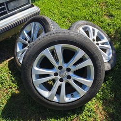 4  car tires with rims