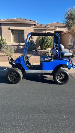 Titled licensed gas EZ go Custom Lifted Blue Golf Cart