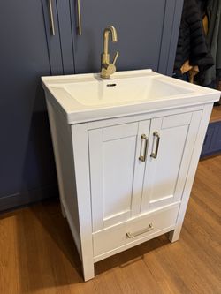 Bathroom vanity (24”, white) with sink & antique brass faucet