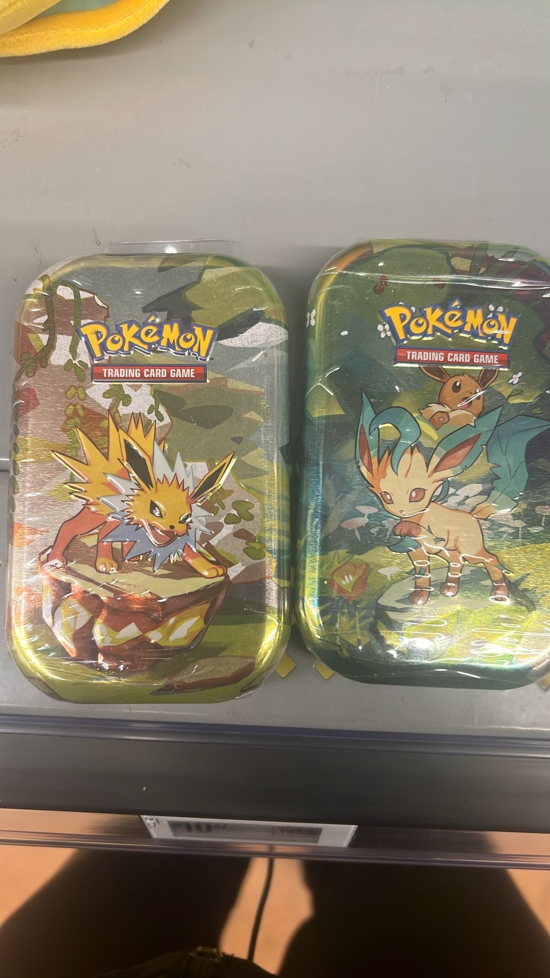 Pokémon Prismatic Evolutions Tins