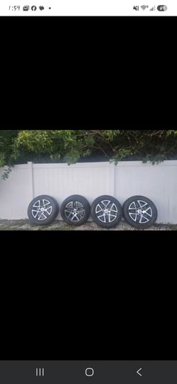 Tires Bridgestone 4 used tires with rims 275/60/20