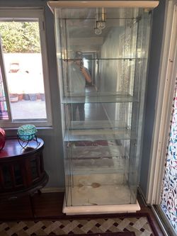 Glass cabinet (dimensions of item unknown, will need to message seller for more info)