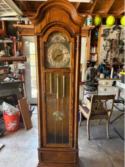 Dining room table and chairs and grandfather clock