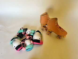 Pink rollerskates and pads